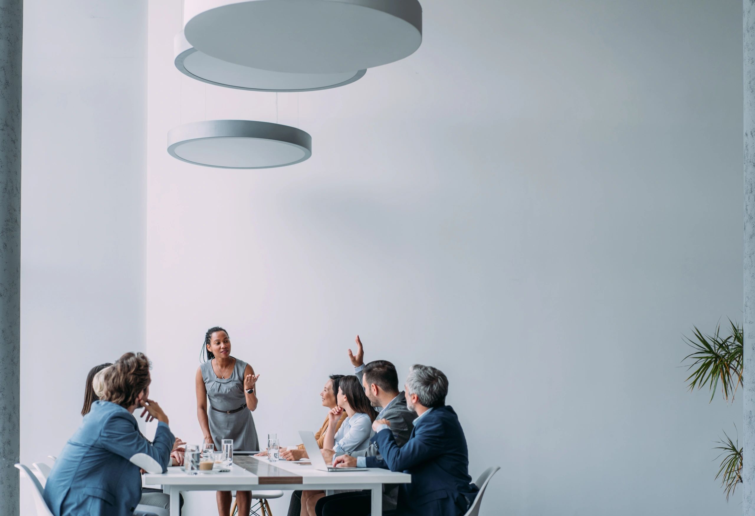 Consultant presenting to a business team in a board room